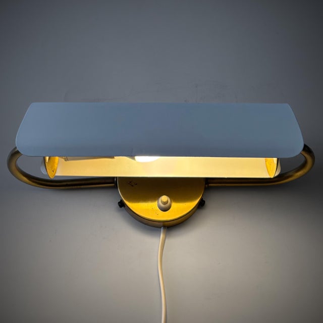 A swedish modernist wall lamp or bedside reading light, model 4131, designed in the 1950s by bertil brisborg for the...
