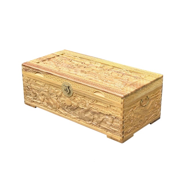Discover the exquisite craftsmanship of this stunning hand-carved wooden treasure chest, a perfect blend of elegance and...