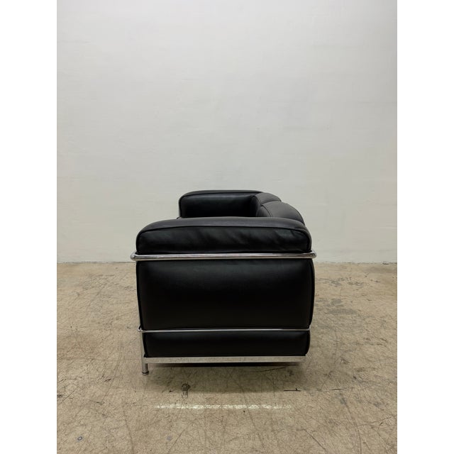 Black leather and chrome plated tubular steel LC2 two-seater loveseat, designed by Le Corbusier, Pierre Jeanneret, and...