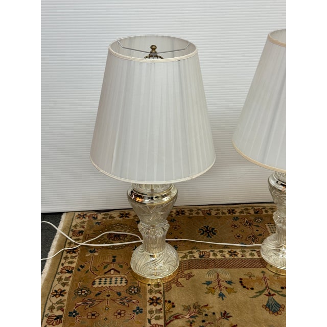 Design Plus Gallery presents a Pair of Cut Glass + Brass Vintage Lamps from Stiffel. Illuminate your space with the...