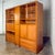 Handsome vintage Scandinavian Modern 3-piece display cabinet or storage wall unit composed of a lighted teak frame, 3...