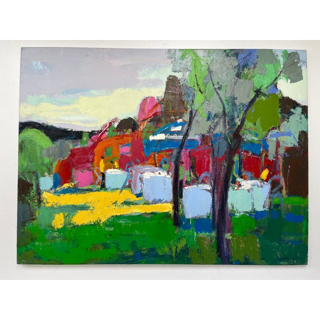 This colorful 36” x 48” original oil painting captures a lively café terrace nestled in nature. Bold reds, pinks, and...