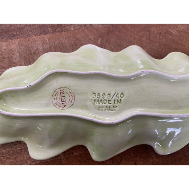 Lovely Vietri leaf tray in soft shades of celery green. The 16” length makes this piece a great accent for serving or...