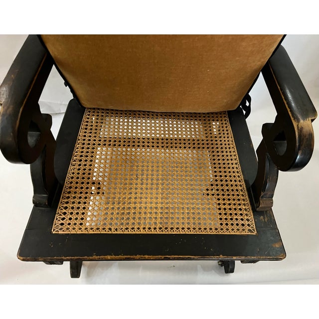 Early 20th Century Vintage Eastlake Design Ebonized Rocking Chair With Cane Seat and a Newly Constructed Padded Fabric Back and Cushion For Sale - Image 4 of 10