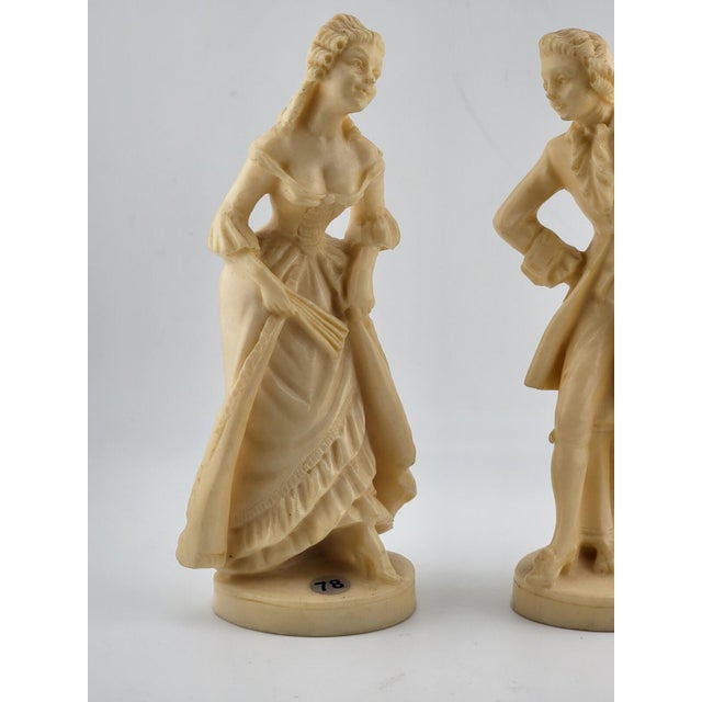 This beautiful sculpture by A. Santini depicts a colonial Victorian man and woman couple, signed by the artist and made in...