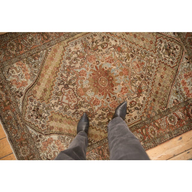 :: Central floral top view medallion with stemmed vines bursting outward in expressive arabesques defining a partial...