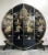 A mid-century, black lacquer, chinoiserie, round room divider/screen consisting of 4 panels on painted lion legs. The...