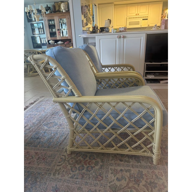 1986 2 Ficks Reed club chairs in distressed pineapple bamboo. The arms were revarnished in 2008 with a light satin...