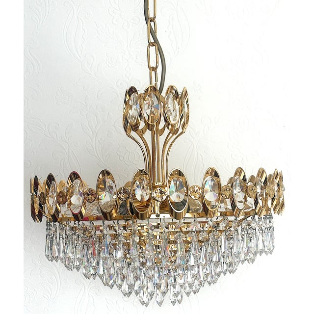 24 Karat Gold-Plated Brass and Crystal Chandelier, 1970s, in Very Good conditions. Designed 1970 to 1979 I have official...