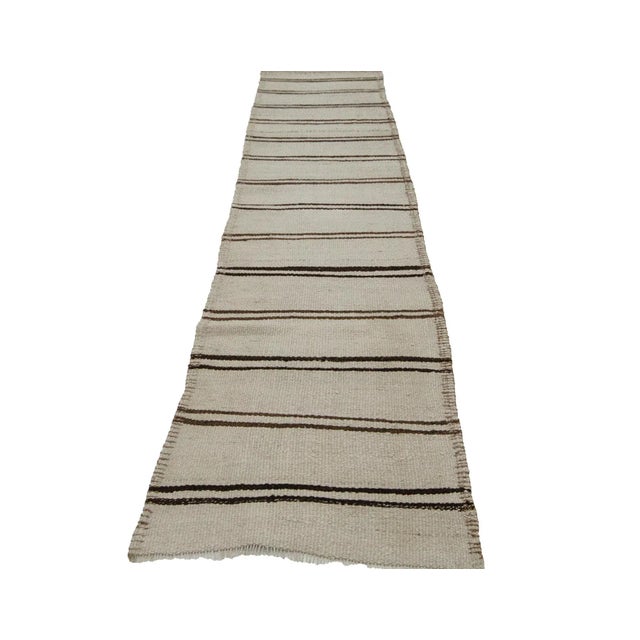 Handwoven vintage striped natural kilim rug from Northern Iraq. Approximately 50-60 years old. In very good condition.