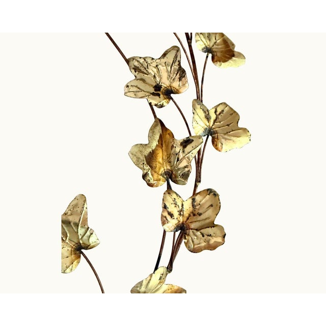 Sculptural brass wall art featuring ivy leaves on branching wire stems. Beautifully detailed leaf forms with natural...