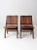 This is a pair of mid 20th century slat wood folding chairs. Featuring elegant curving slat wood seats and backs, the...