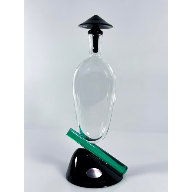 The bottle in in perfect condition beside a small imperfection inside the base, which is invisible when placed on a table....