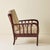 Armchair attributed to Vittorio Valabrega, dating to the 1940s. The design features a sculptural solid wood frame with...