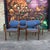 This is a set of 4 Don Pettit for Knoll Model 1105 armchairs. They feature a dark stained bentwood frame and blue and tan...