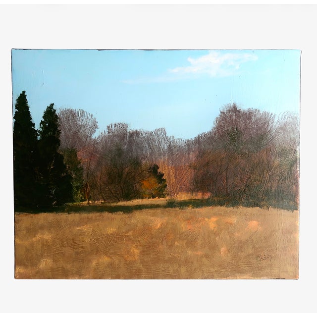 An original oil painting by American artist William Rabon, depicting a quiet autumn landscape beneath a pale blue sky. The...