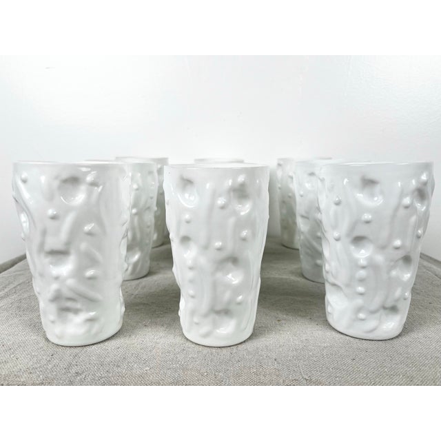 Mid century set of 9 milk glass tumblers. Made by Bryce Brothers for the El Rancho line. Retro abstract cactus like shape....