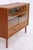 Vintage 1960s chest of drawers with glass sliding doors and two spacious drawers. The successful combination of display...