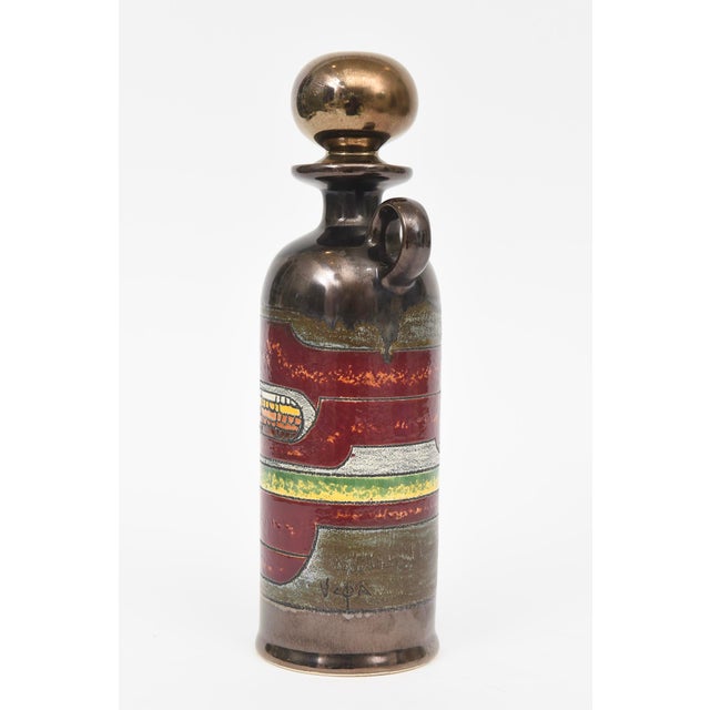 This painterly signed vintage glazed ceramic decanter object is very abstract in colorful bands and forms. It is signed...