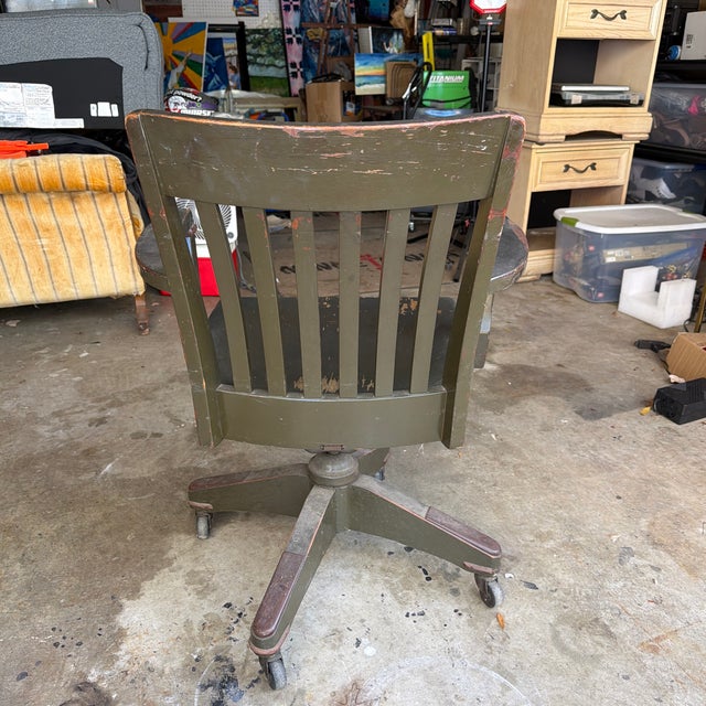 Antique olive green wooden office chair from the BL Marble Chair Company. This was part of the Met Life Insurance Co. with...