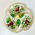 A lovely divided pottery divided serving dish from Italy. It’s hand-painted and has a Pear in the center in the Trompe...