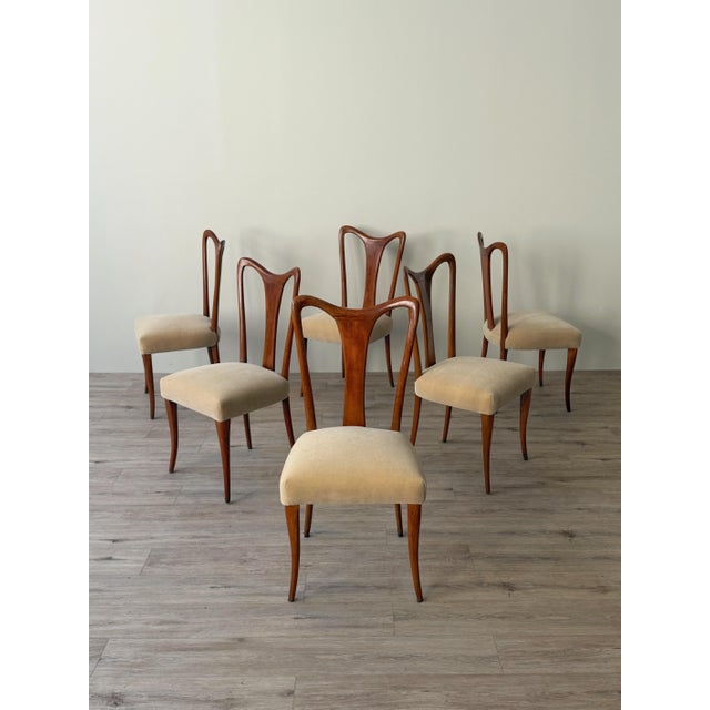 A set of 6 Italian dining chairs, circa 1950s, with shaped wood frames and seats newly reupholstered in cream mohair...
