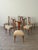A set of 6 Italian dining chairs, circa 1950s, with shaped wood frames and seats newly reupholstered in cream mohair...