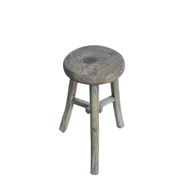 This is a rustic, handcrafted wooden stool featuring a simple yet sturdy design that exudes timeless charm. The stool has...
