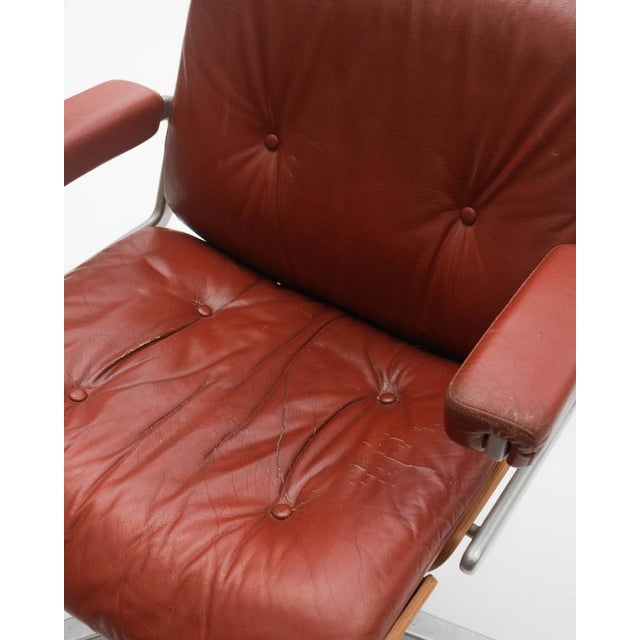 This Mid-Century Modern-style office chair, designed by the team of Karl Dittert and Martin Stoll for the Swiss firm...