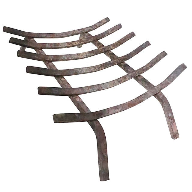 Nice large fireplace inset grate, log holder having six support bars, mounted on the two leg brackets. This example is...