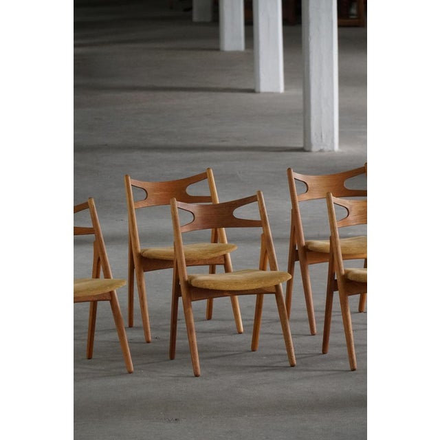 Elegant set of six ch29 “sawbuck” (danish: savbukkestol) dining chairs designed by hans j. Wegner in 1951 and produced by...
