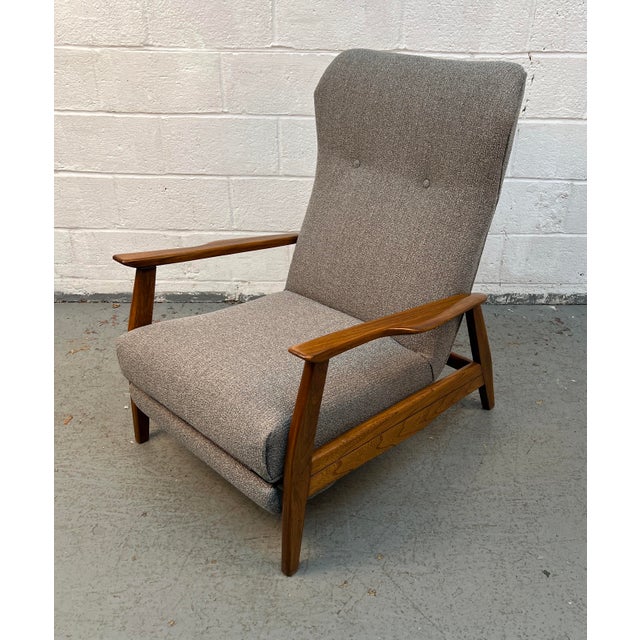 Relax in timeless Mid-Century Modern style with this beautifully crafted walnut reclining lounge chair and matching...