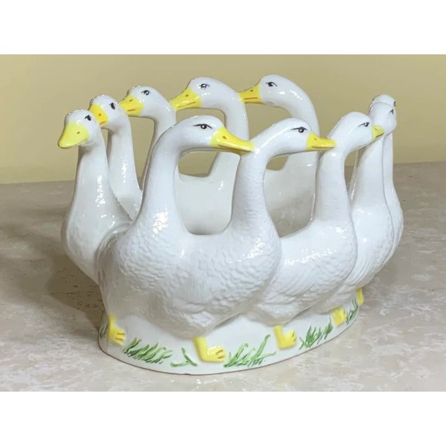 Beautiful candy dish made of porcelain of ducks back to back each other in a circle, vive details on a Snow White color...