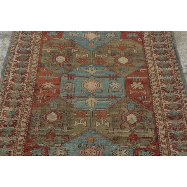 Hand-knotted in wool and dating to circa 1910–1919, this 4x5 antique Turkish rug features geometric medallions, angular...