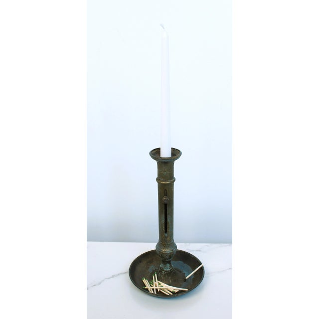 A authentic French 19th Century brass chamberstick with heavy tarnish. These candle holders often had functioning candle...