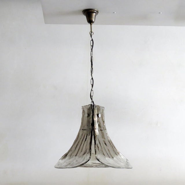 Wonderful floral pendant light by Carlo Nason for AV Mazzega, Italy and J.T. Kalmar, Austria, with three hand-made clear...