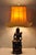 Vintage Chinoiserie Buddhist Kuan Yin Brown Ceramic Sculpture Figure Table Lamp w/ Shade. Circa Mid 20th Century....