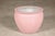 This vintage Chinese ceramic planter features a softly rounded form finished in a delicate blush pink glaze with an...