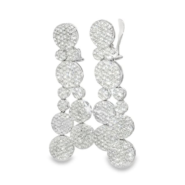 Stunning estate earrings crafted in 18K white gold , featuring brilliant round diamonds totaling 6.3 carats. Elegant...