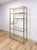 This gorgeous vintage Milo Baughman style brass toned shelf is a sleek and glamorous display piece that brings serious...