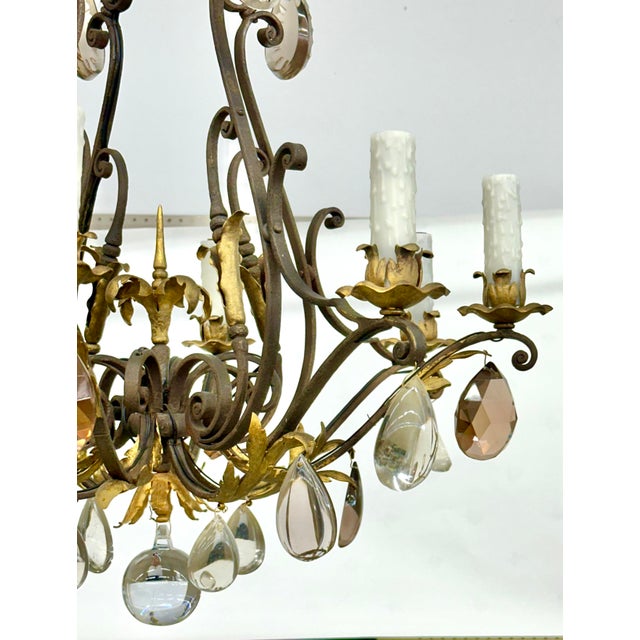 Incredible 1940's quality Italian style iron chandelier with gold painted accents, decorated with large scale clear,...