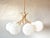Beautiful mid - Century design. 1970s sputnik chandelier. Brass base with 8 curved arms from which white sculpted thick-...