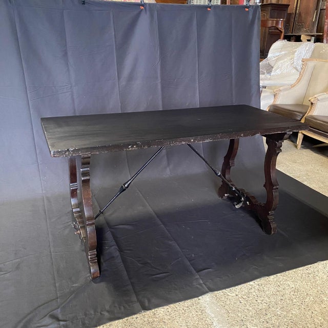 Elegant Italian dining table, console table or writing desk with stunning wrought-iron stretchers in a wonderful size....