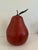 Realistic extra large, red porcelain dimpled pear with metal stem and leaves Black felt round piece covers the bottom....