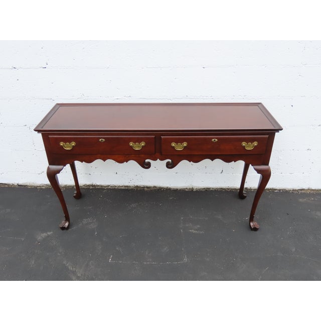 This Console Table is made of wood, solid wood, veneer, and metal, the wood might be cherry or mahogany. The Console was...