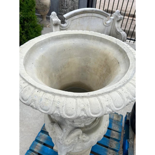 After the original 18th century garden vases, entitled Autumn, by Jean-Baptiste Pigalle, this pair of large cast garden...