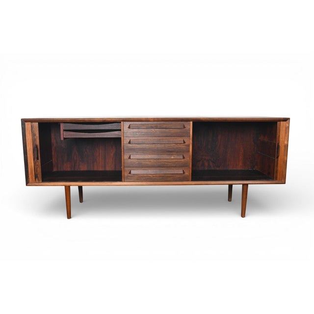 Origin: Denmark Designer: Ib Kofod Larsen Manufacturer: Faarup Møbelfabrik Era: 1960s Materials: Walnut Measurements: 80"...