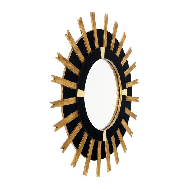 Modernist sunburst mirror from Spain made of hand-applied gold leafed wood. The rays emanate from a circular central...