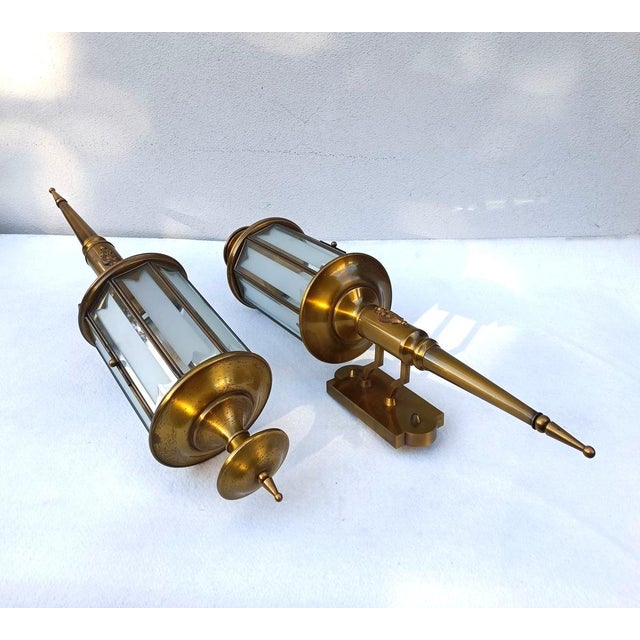 Pair of large wall lamps of great decorative effect made of gilded bronze and frosted geometric glass. Window opening in...