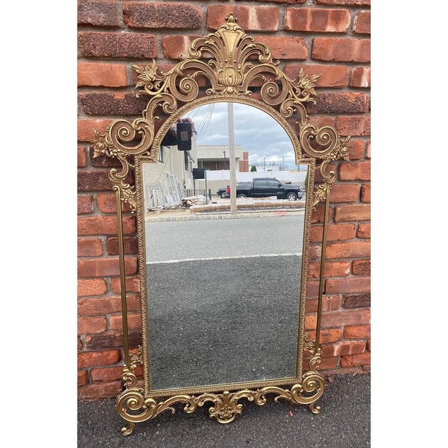 Elegant Italian brass console with a marble top and matching mirror. Made in Italy, this ensemble is the perfect foyer or...